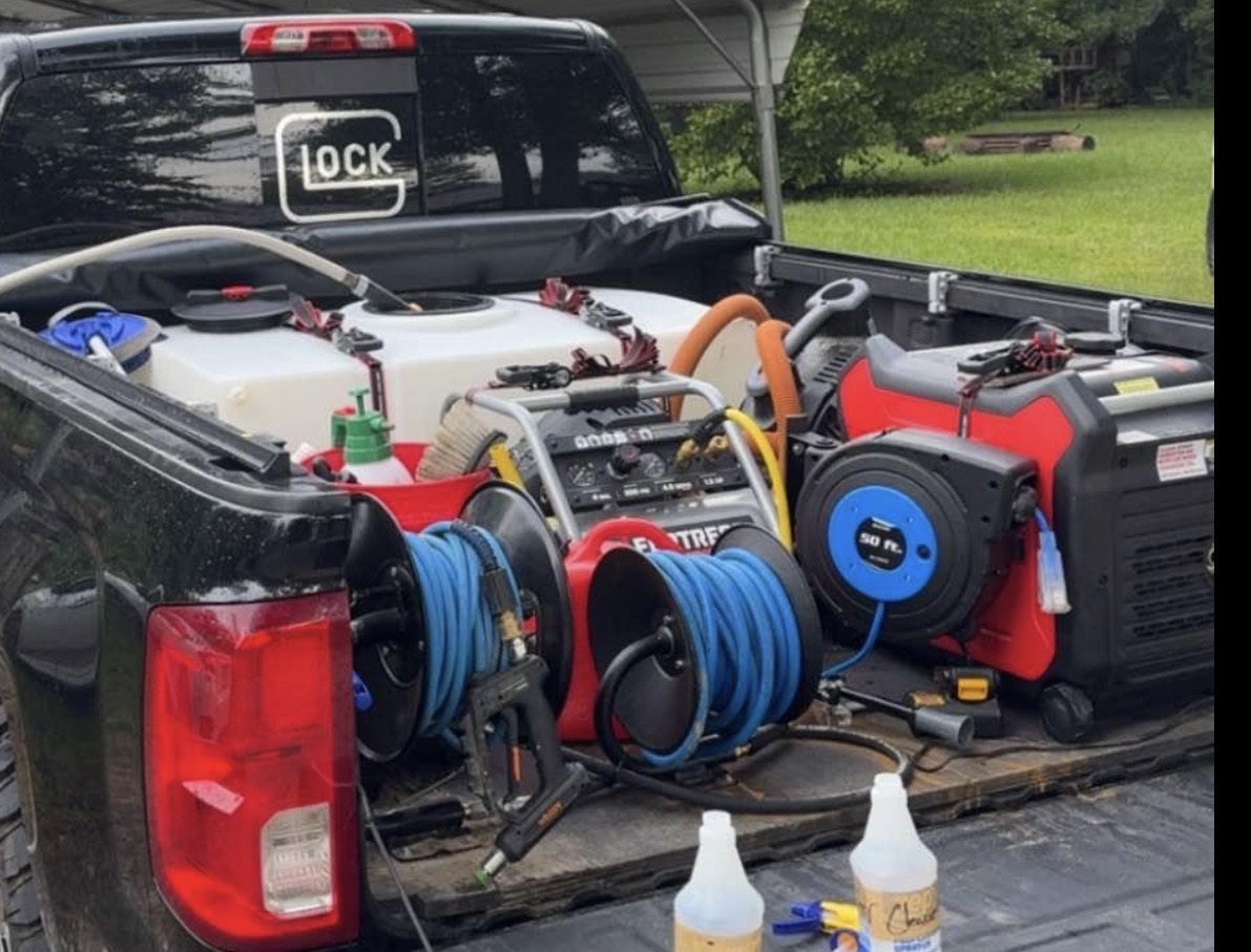 Gulf Gloss mobile detailing equipment with an onboard water tank, hose reels, compressor, and generator